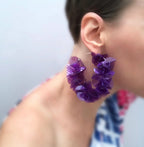 Large purple floral statement earring on woman, contemporary handmade jewelry